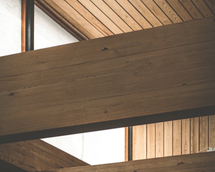 Timber-lined ceiling with exposed beams